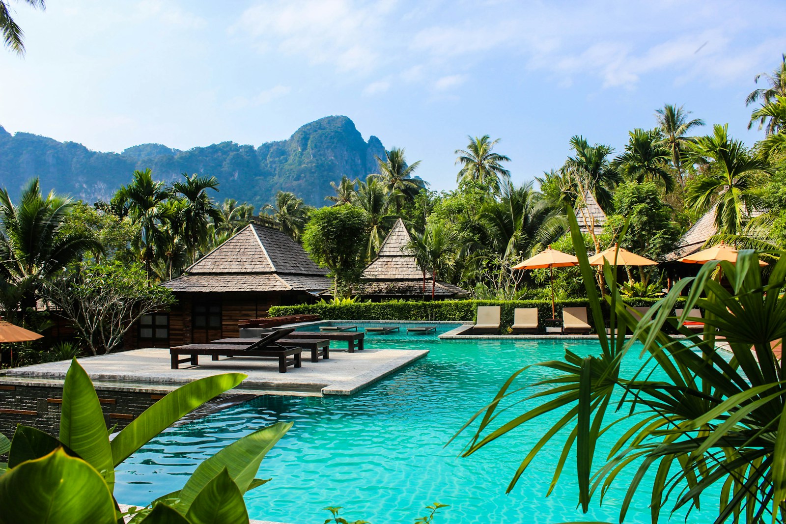 Luxury pool with red umbrellas